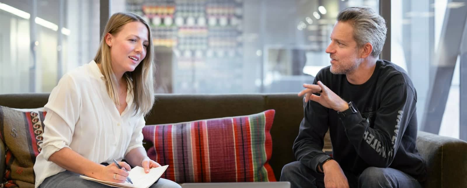 Contact Inter Emirates Properties, your Dubai property agent. A property agent discussing real estate options with a client in Dubai.